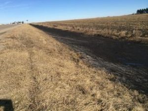 The soil on the snow in a roadside ditch this winter is a stark reminder of the losing proposition confronting U.S. agriculture.