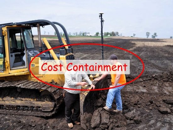 2 men using a dozer to correct the grade on a field