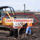 2 men using a dozer to correct the grade on a field