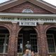 Tom and Peggy standing in front of the George Washington Carver Museum